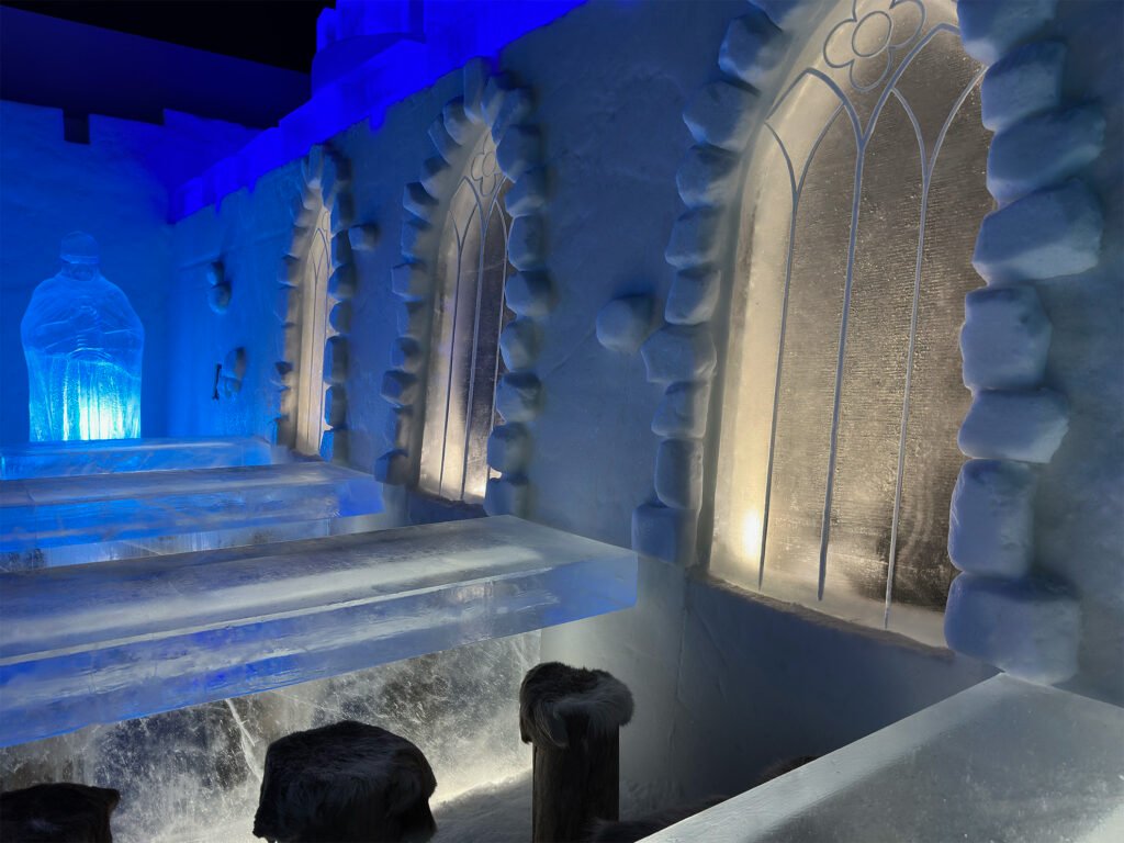 The ice restaurant inside the Snow Castle at Kemi, an ice table set with reindeer-hide seats