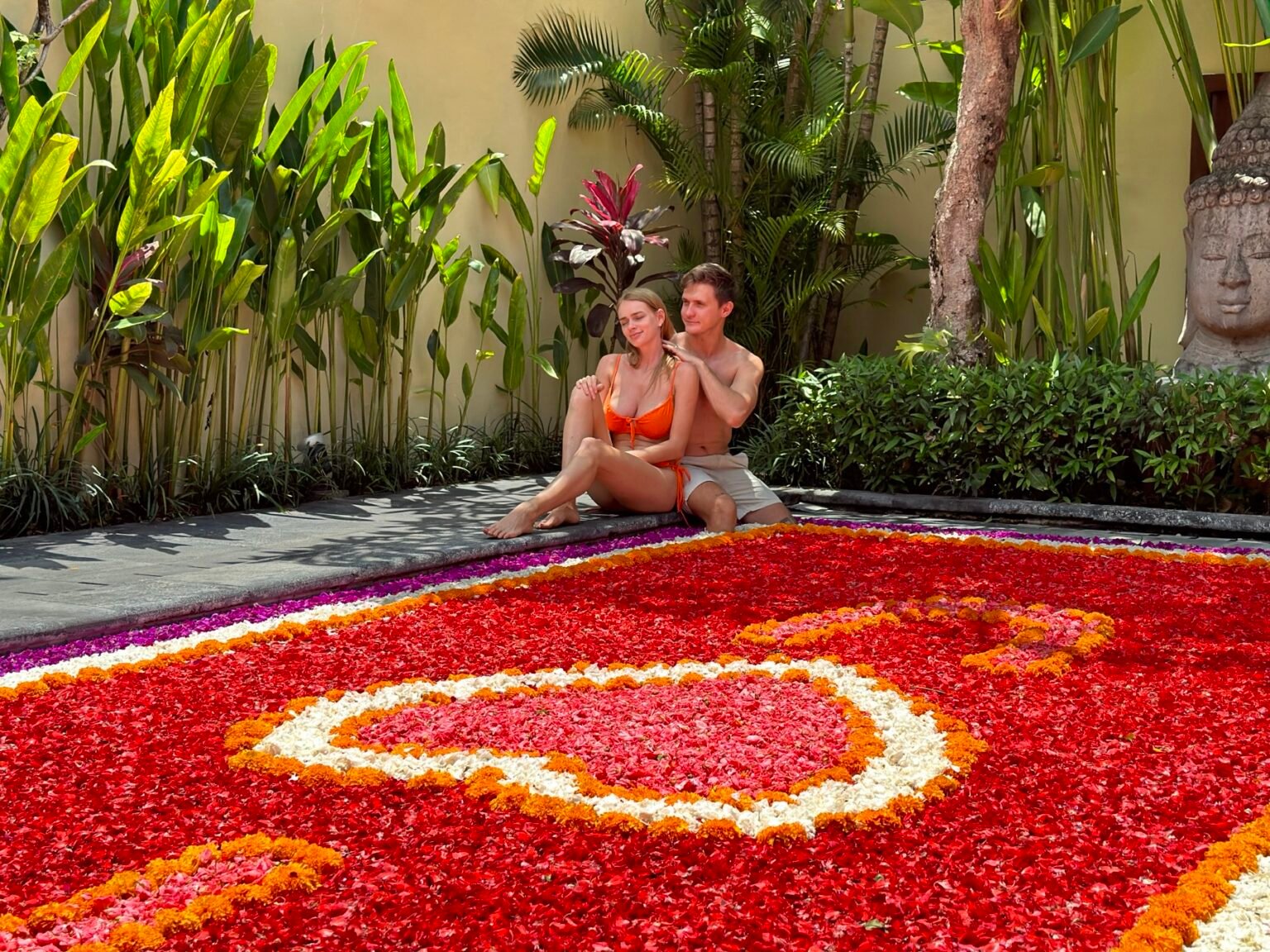 Flower petals arranged on the surface of a villa pool.