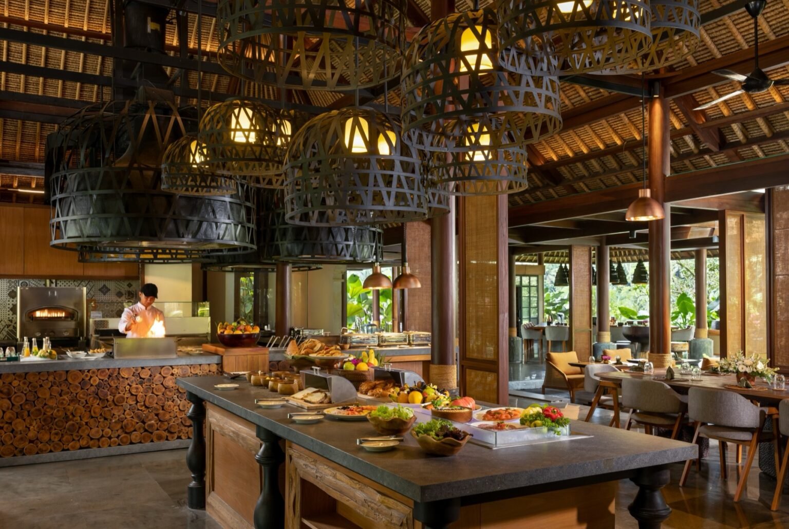 Restaurant tables set for a meal with the valley beyond.