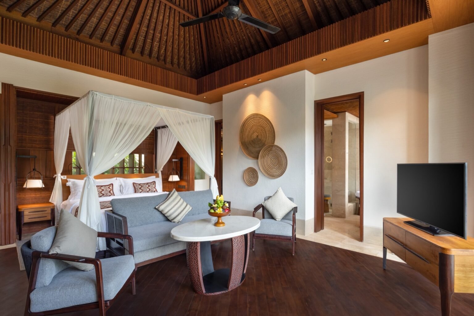 A private villa pool on a terrace overlooking a wooded river valley.
