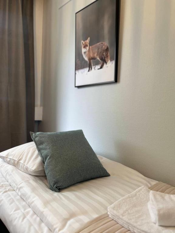 A made bed at the boutique hotel in Kemijarvi