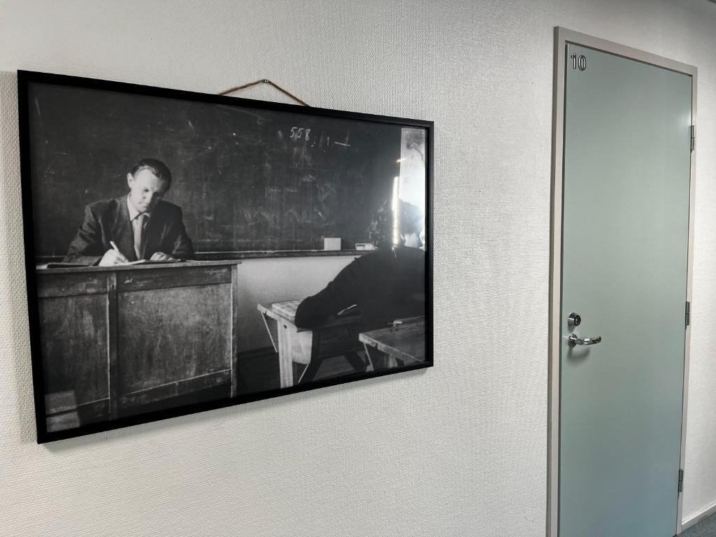 A corridor at the boutique hotel in Kemijarvi, hung with an archive photograph from the building's years as a school