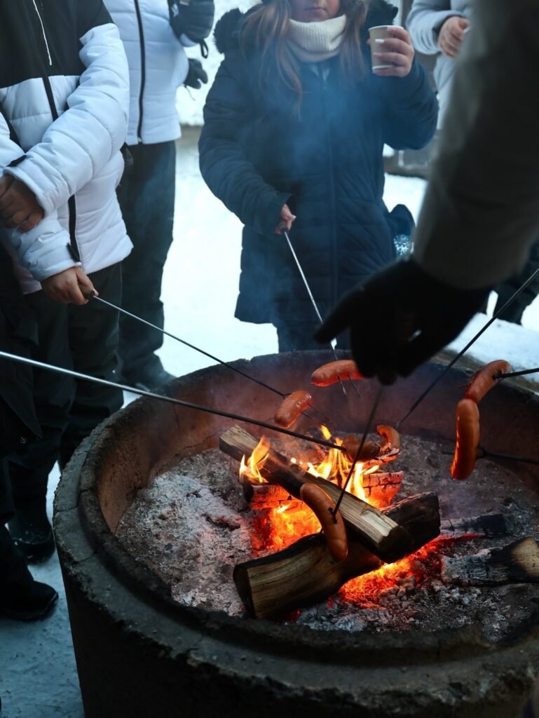 A campfire burning in the snow in Lapland