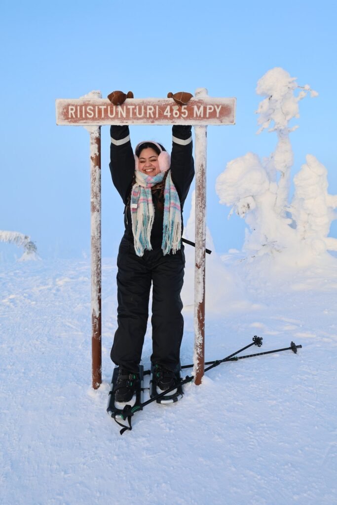 Ski touring among snow-laden trees at Riisitunturi