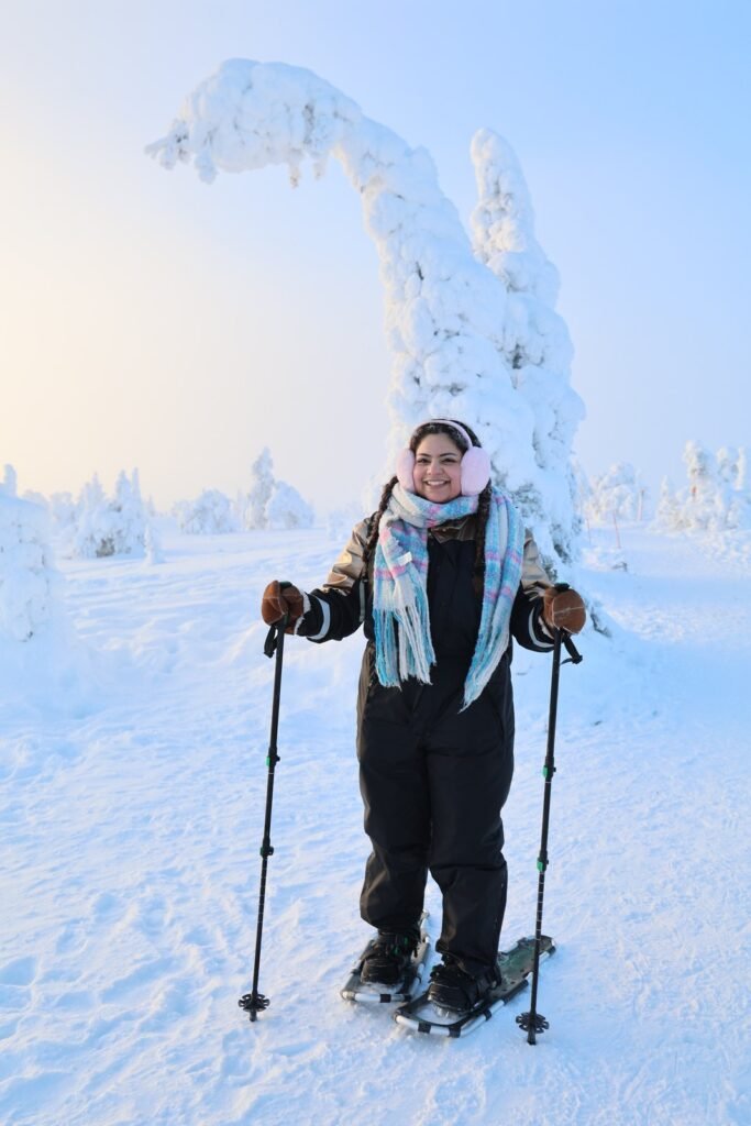 Ski touring among snow-laden trees at Riisitunturi
