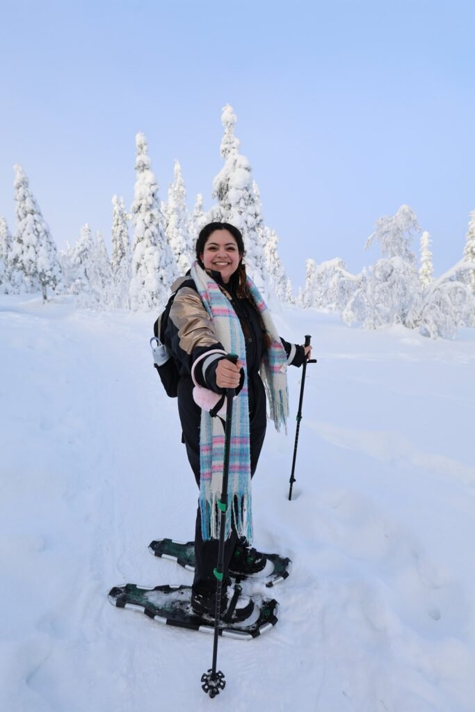 Ski touring among snow-laden trees at Riisitunturi