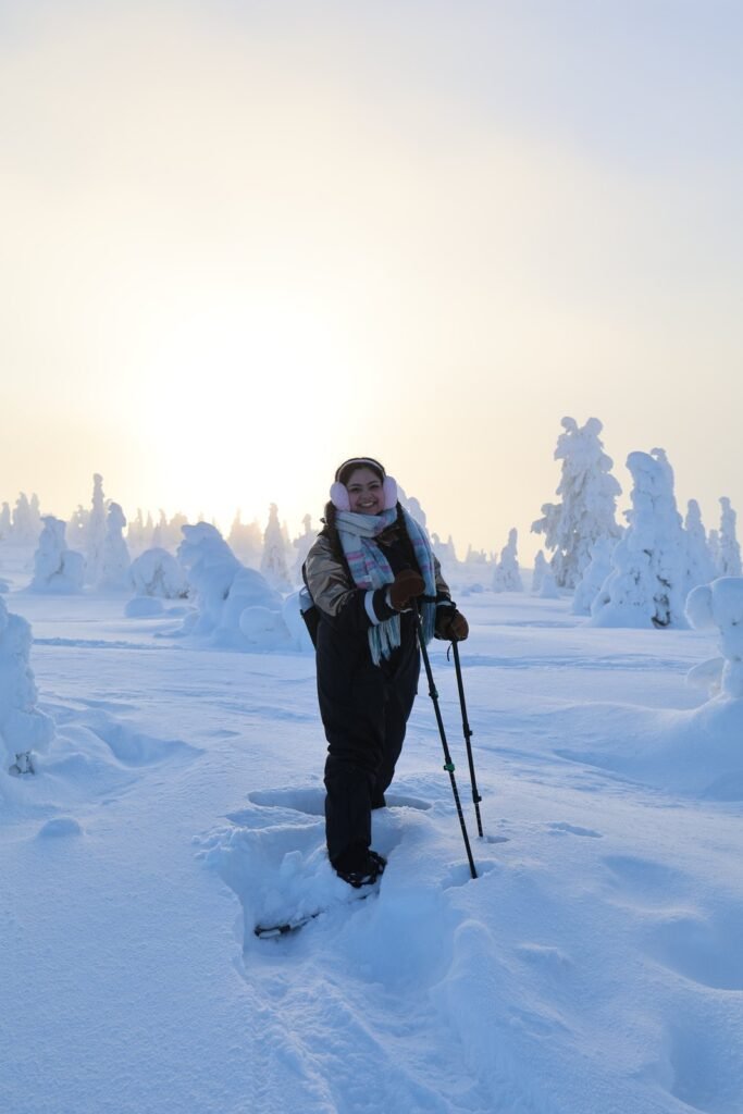 Ski touring among snow-laden trees at Riisitunturi