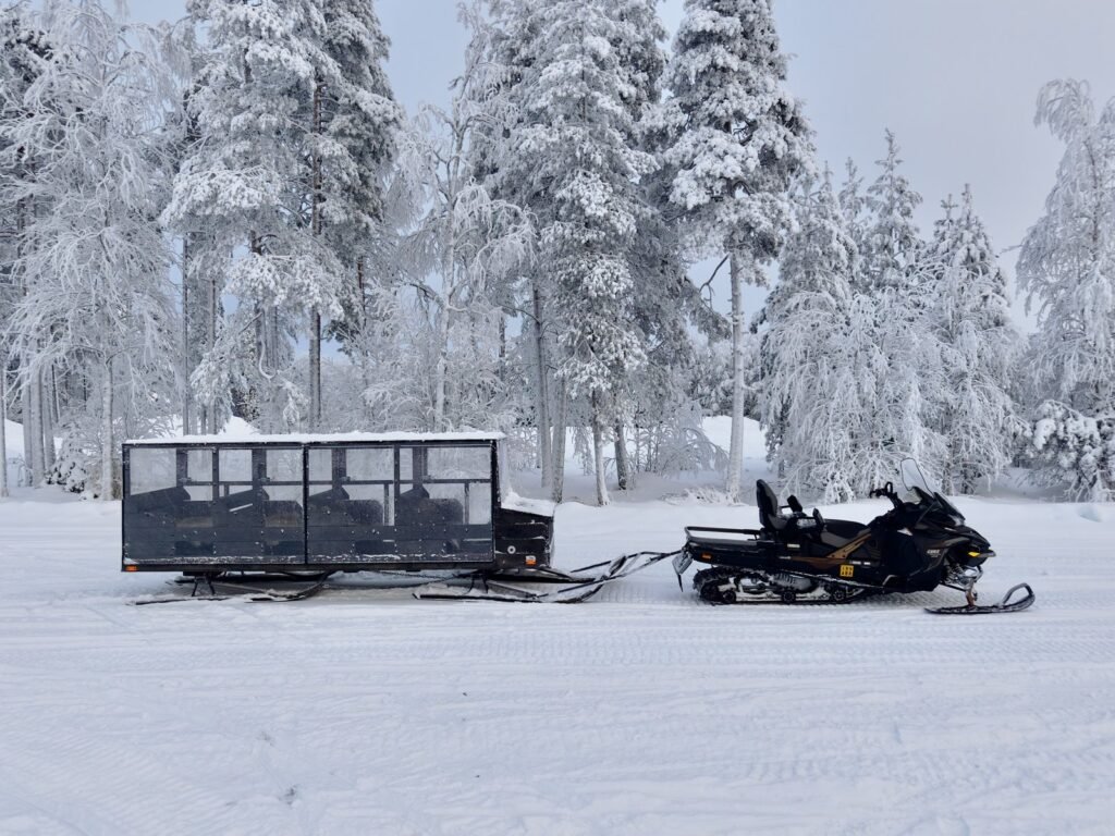 A snowmobile on a forest trail in Lapland