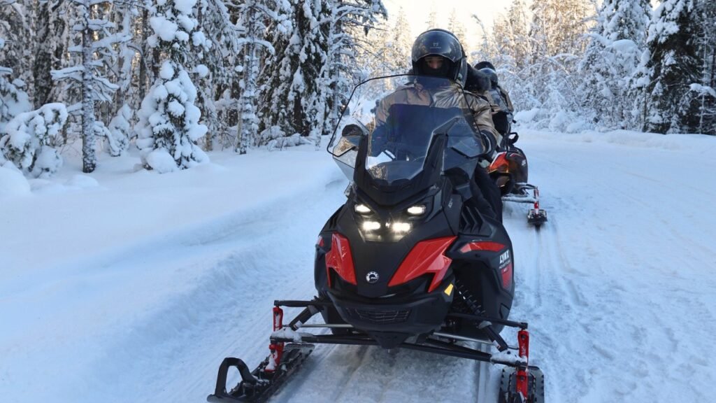 A snowmobile on a forest trail in Lapland