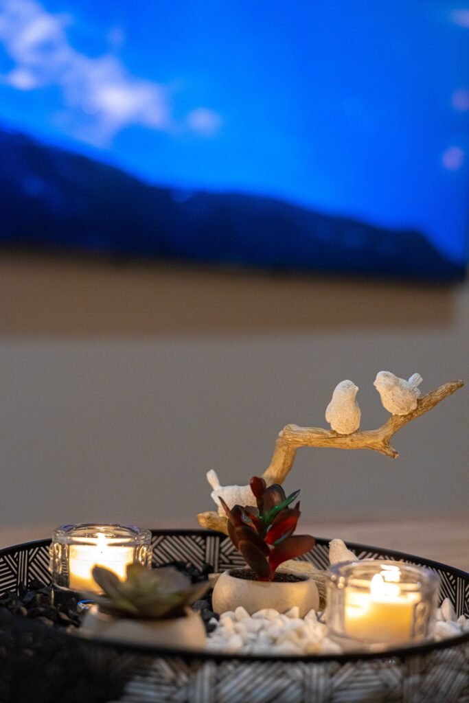 Candles and a small ornament on a table in a luxury apartment in central Rovaniemi