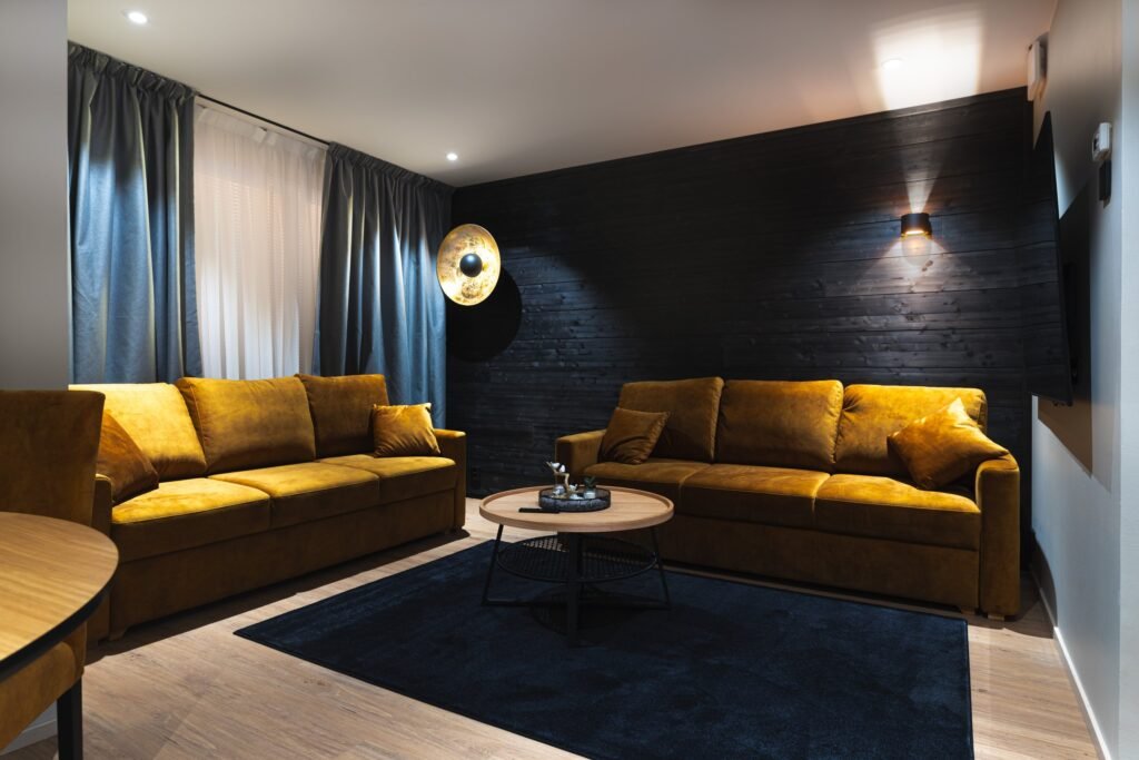 Two sofas and a low table in the living area of an apartment in central Rovaniemi