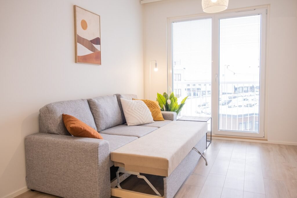 The sofa bed opened out in the living area of an apartment in central Rovaniemi